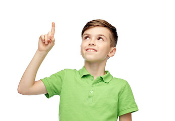 Image showing happy boy in green polo t-shirt pointing finger up