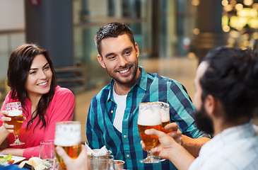 Image showing friends dining and drinking beer at restaurant