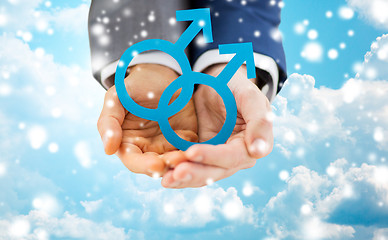 Image showing close up of male gay couple holding gender symbol