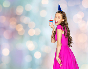 Image showing happy woman or teen girl with birthday cupcake