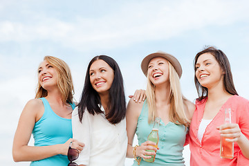 Image showing girls with drinks on the beach