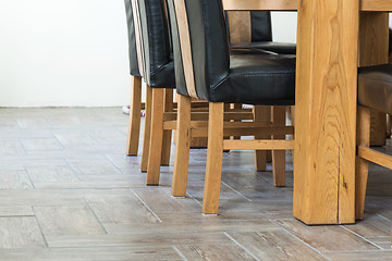 Image showing Closeup of wooden chairs and table legs