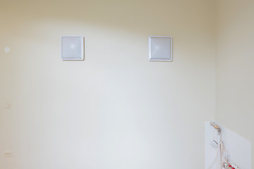 Image showing White blank picture frames over white wall