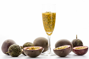 Image showing Passion Fruit Pulp In A Glass Amidst Ripe Fruits