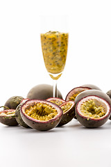 Image showing Halved Passionfruits And Fruit Pulp In A Glass