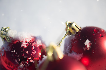 Image showing red christmas ball in fresh snow