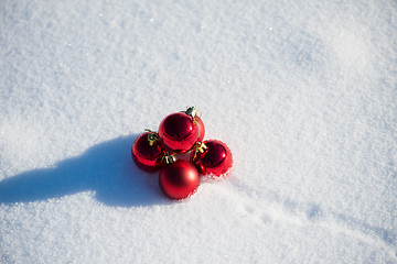 Image showing red christmas ball in fresh snow