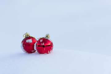 Image showing red christmas balls in fresh snow