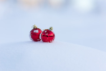 Image showing red christmas balls in fresh snow