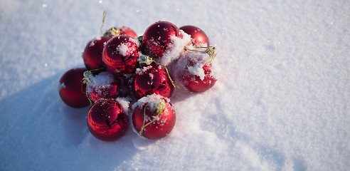 Image showing red christmas ball in fresh snow