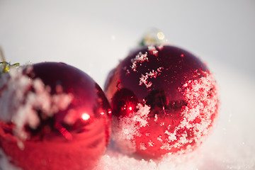 Image showing red christmas ball in fresh snow