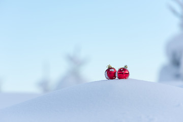 Image showing red christmas balls in fresh snow