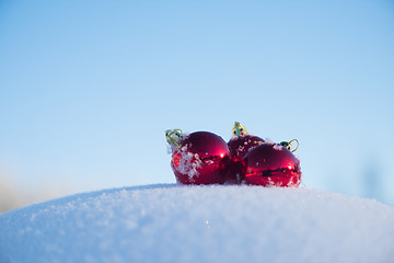 Image showing red christmas ball in fresh snow