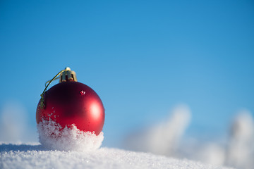 Image showing red christmas ball in fresh snow