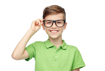 Image showing happy boy in green polo t-shirt and eyeglasses