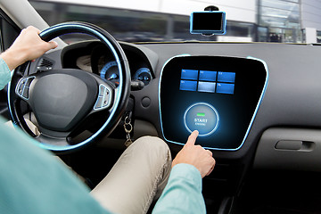 Image showing close up of man in car with starter on computer