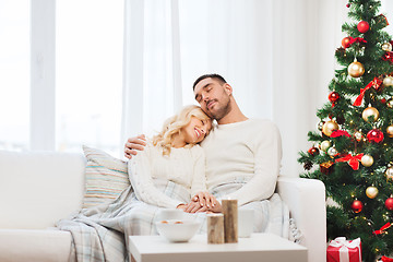 Image showing happy couple at home with christmas tree