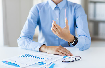 Image showing close up of woman with transparent smartphone