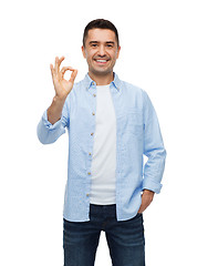 Image showing smiling man showing ok hand sign