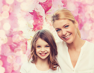 Image showing smiling mother and little girl