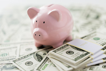 Image showing close up of dollar money and pink piggy bank