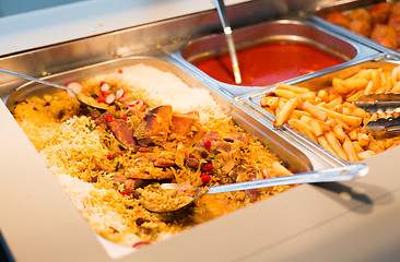 Image showing close up of rice pilaf and other dishes on tray