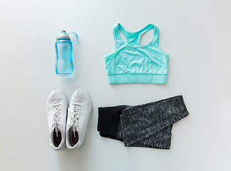 Image showing close up of female sports clothing and bottle set