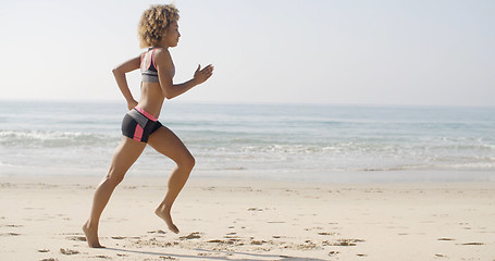 Image showing Woman Running On The Beach