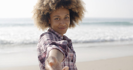 Image showing Happy Woman Giving Hand On Beach