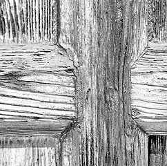 Image showing grain texture of a brown antique wooden old door in italy   euro