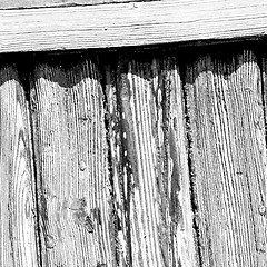 Image showing grain texture of a brown antique wooden old door in italy   euro