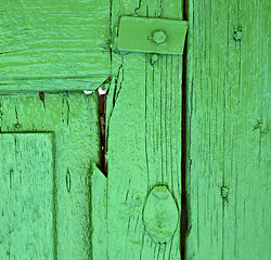 Image showing  piece of colorated green wood as a window