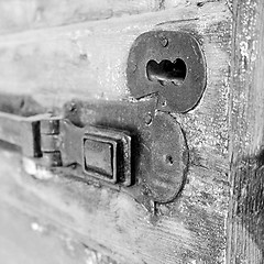 Image showing europe old in  italy  antique close brown door and rusty lock  c