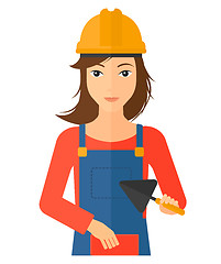 Image showing Bricklayer with spatula and brick.