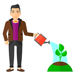 Image showing Man watering tree.