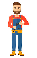 Image showing Cheerful repairman with spanner.