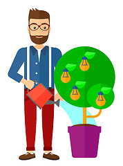 Image showing Man watering tree with light bulbs.