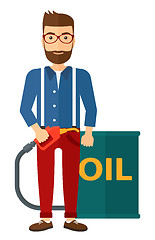 Image showing Man with oil can and filling nozzle.