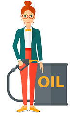 Image showing Woman with oil can and filling nozzle.