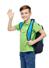 Image showing happy student boy with school bag waving hand