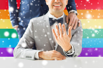 Image showing close up of male gay couple with wedding rings on