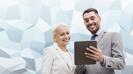 Image showing smiling businessmen with tablet pc outdoors