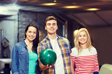 Image showing happy friends in bowling club