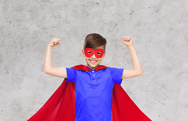 Image showing boy in red super hero cape and mask showing fists