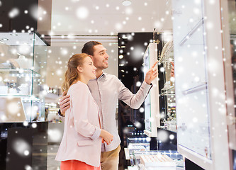 Image showing couple looking to shopping window at jewelry store