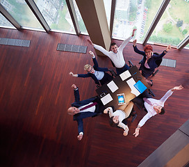 Image showing top view of business people group throwing dociments in air