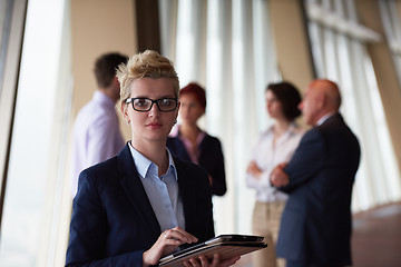 Image showing diverse business people group with blonde  woman in front