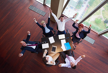 Image showing top view of business people group throwing dociments in air