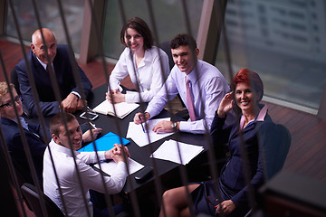 Image showing business people group on meeting at modern bright office