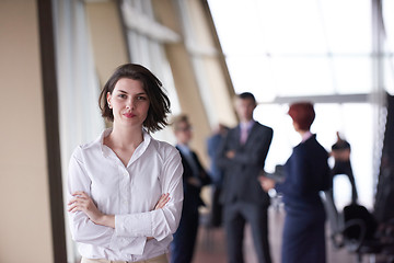 Image showing business people group, woman in front  as team leader